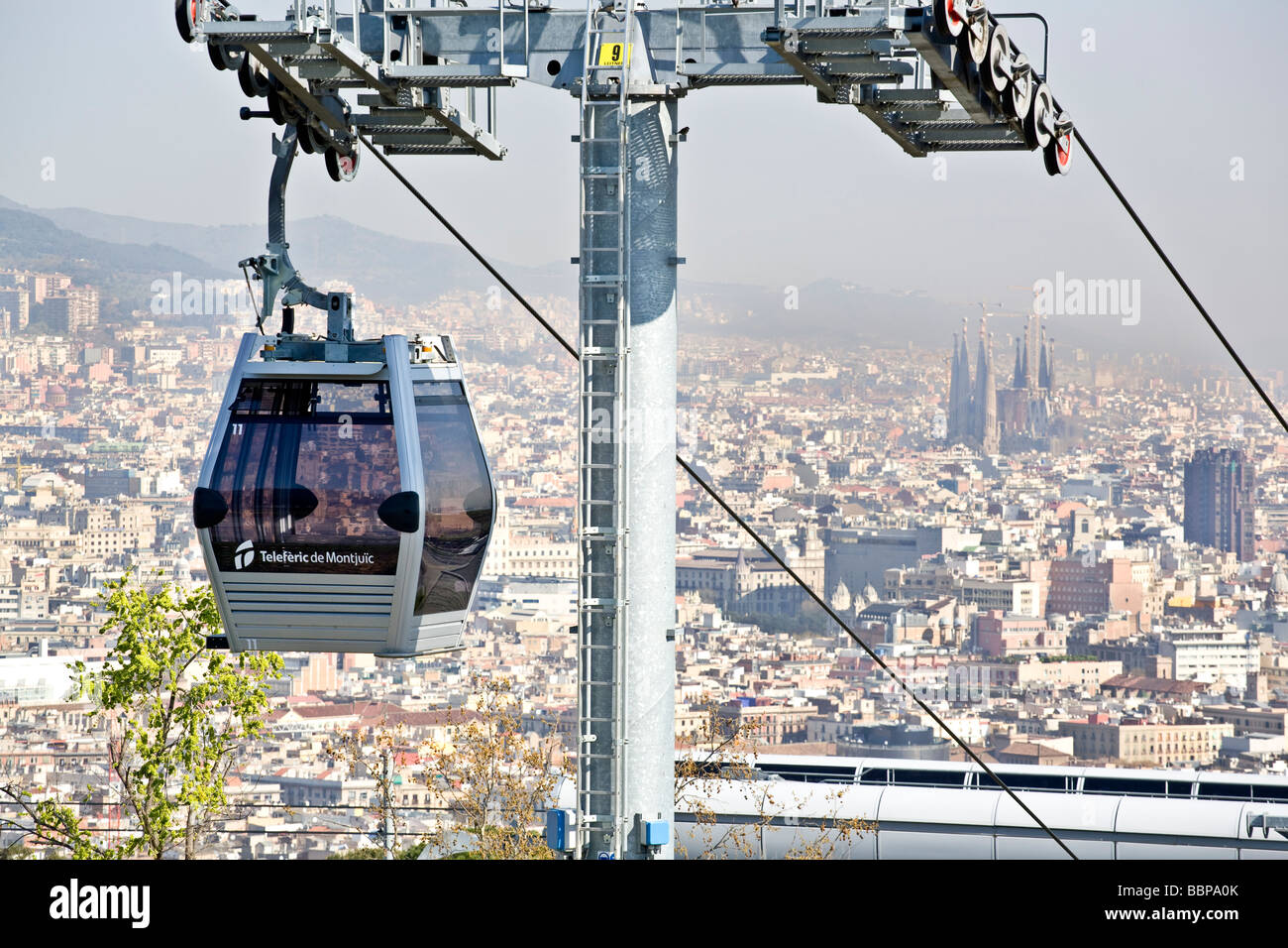 montjuic cable car and barcelona with sagrada familia behind Stock ...