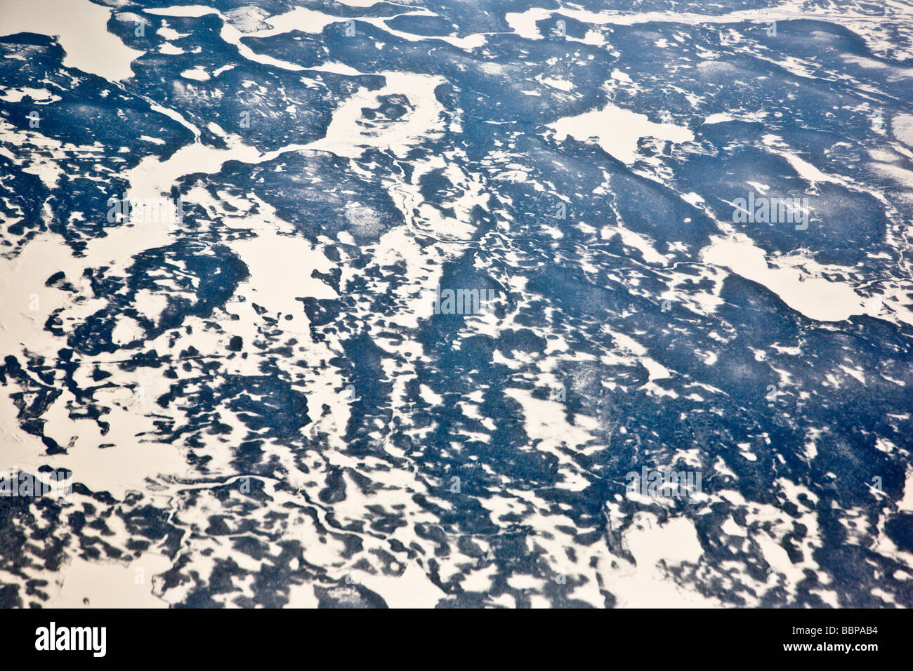 The awe-inspiring polar ice cap can be seen in this view from a plane, traveling from Frankfurt, Germany, to Washington, DC. Stock Photo