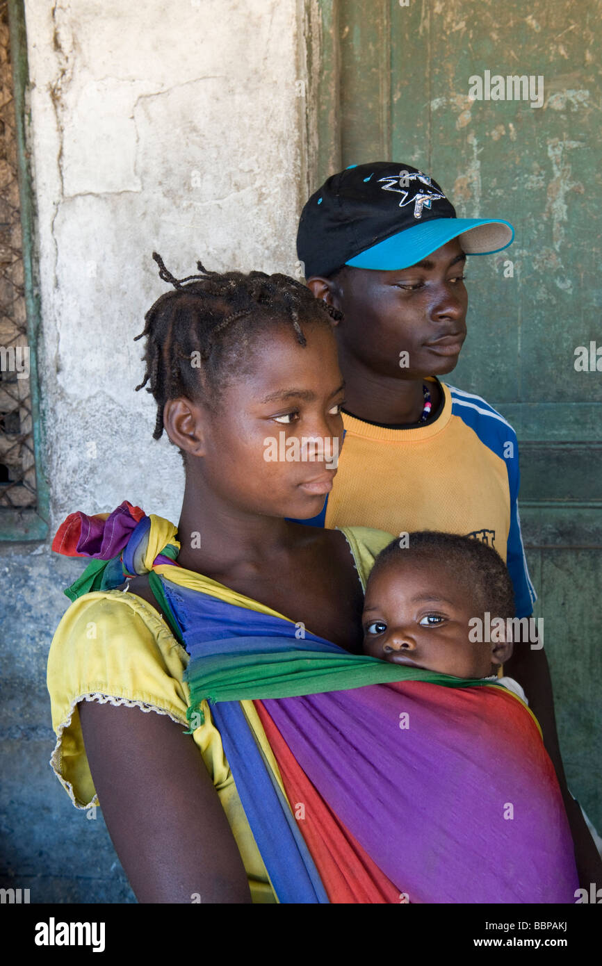 A young couple with their child attending an HIV AIDS awareness campaign Quelimane Mozambique Stock Photo