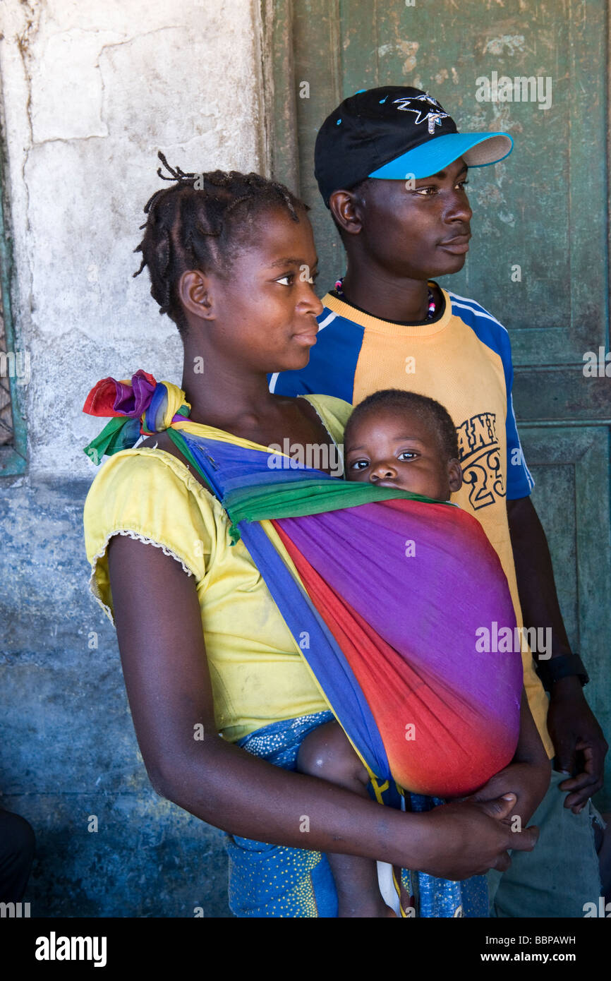 A young couple with their child attending an HIV AIDS awareness campaign Quelimane Mozambique Stock Photo