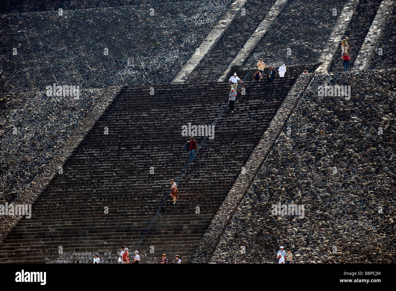 Climbing the stairs of The Pyramid of the Sun at Teotihuacan in Mexico ...