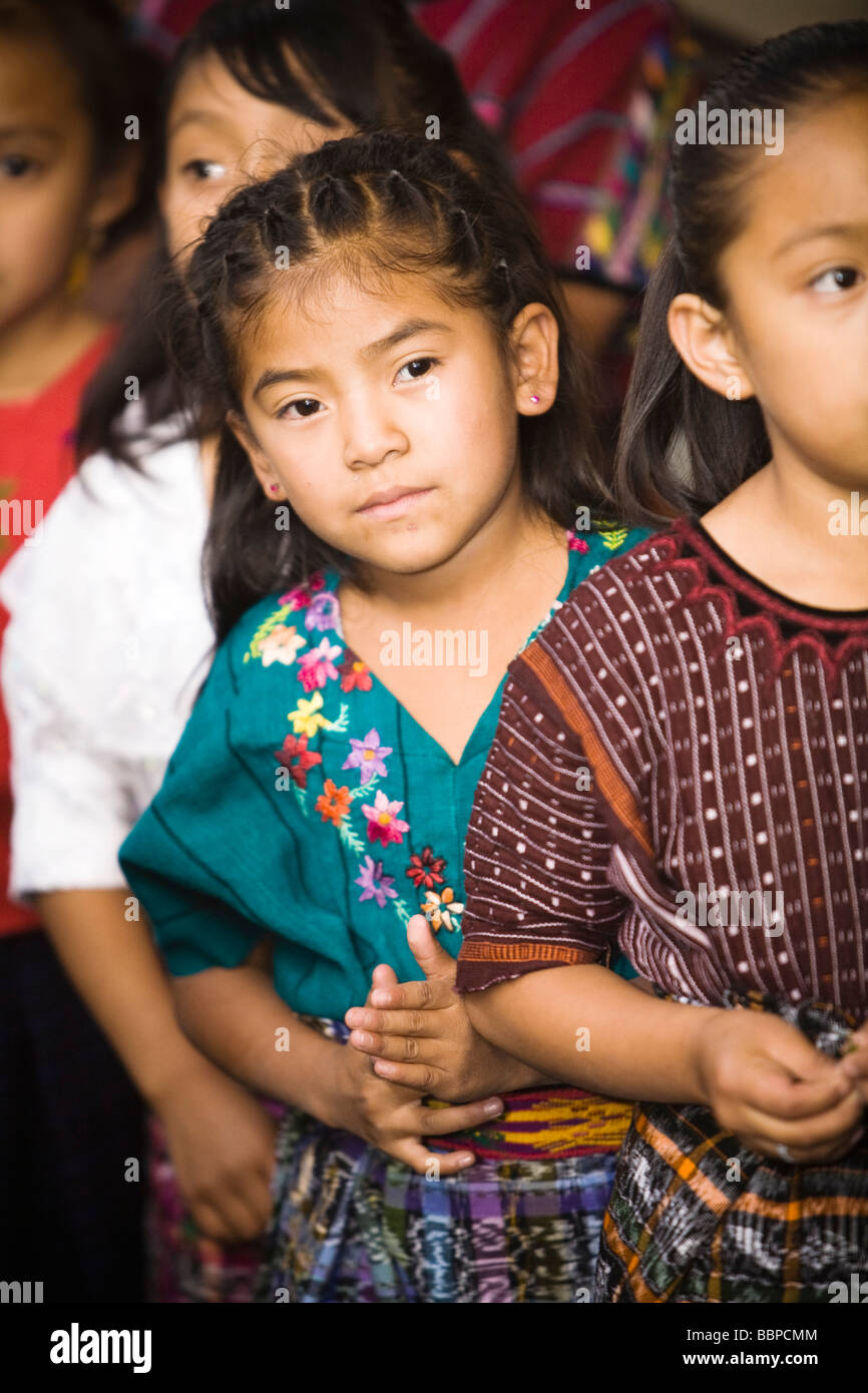 Guatemala;Young girls in traditional clothing waiting in line Stock