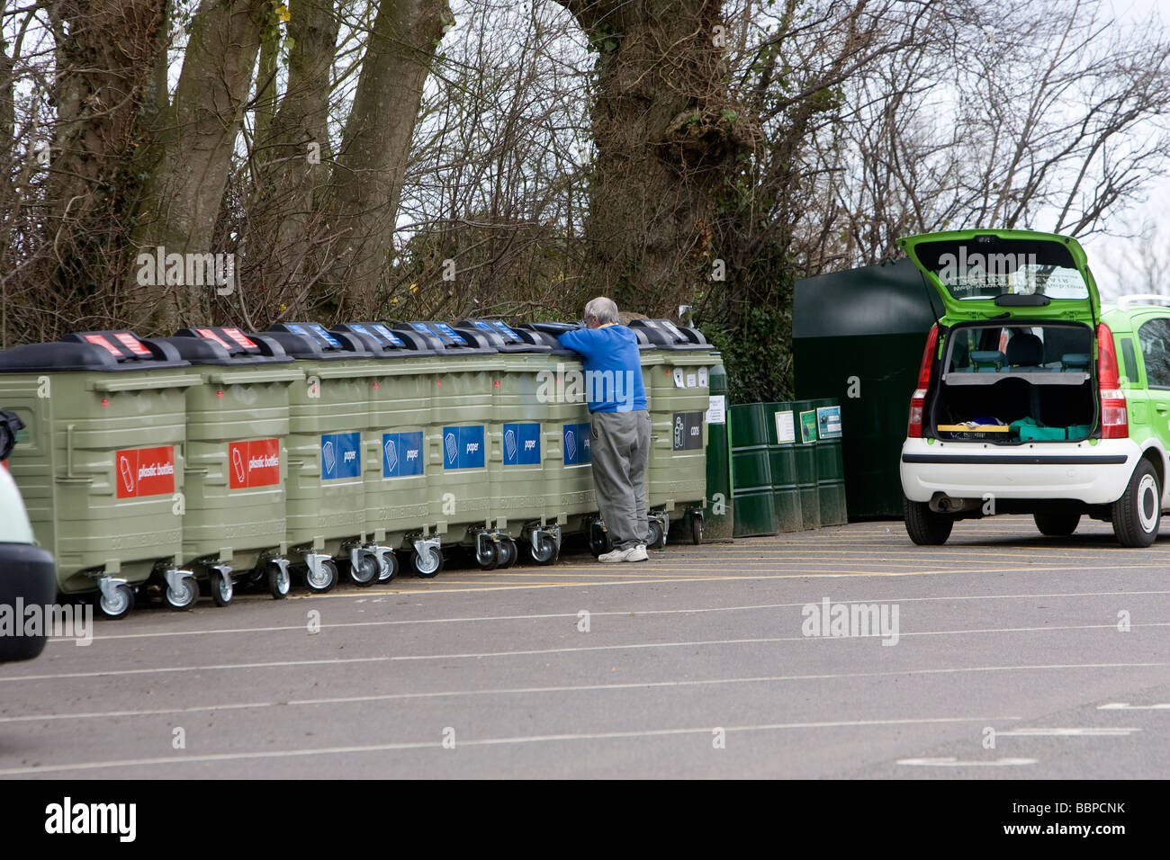 A man disposes of his household waste after bringing it in his car Stock Photo
