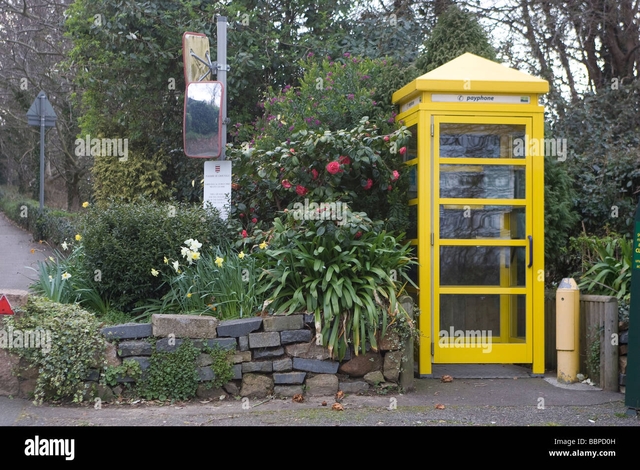 A Yellow Telephone box Stock Photo