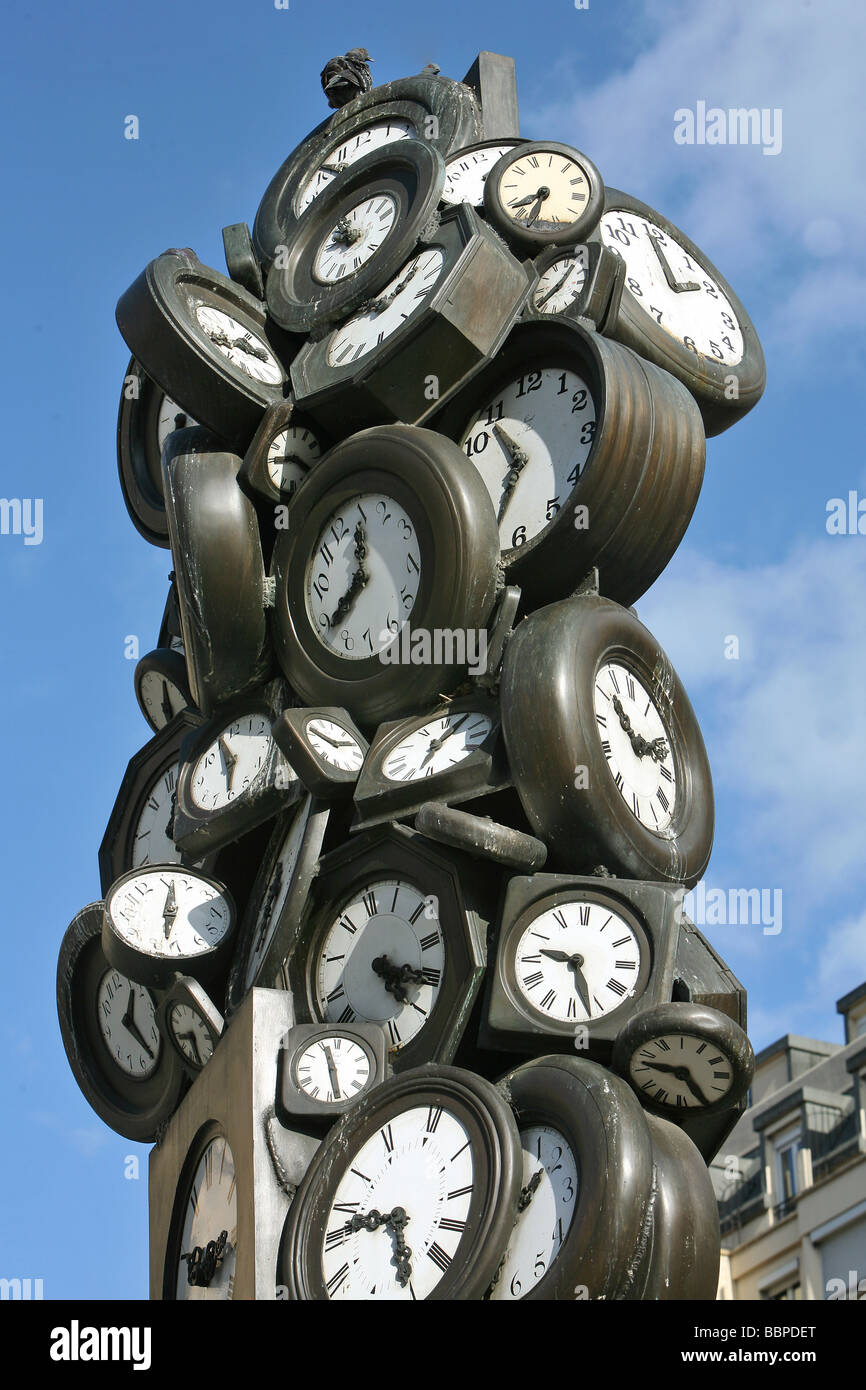 THE CLOCKS', SCULPTURE BY THE ARTIST ARMAN, IN FRONT OF THE SAINT LAZARE  TRAIN STATION, PARIS, FRANCE Stock Photo - Alamy