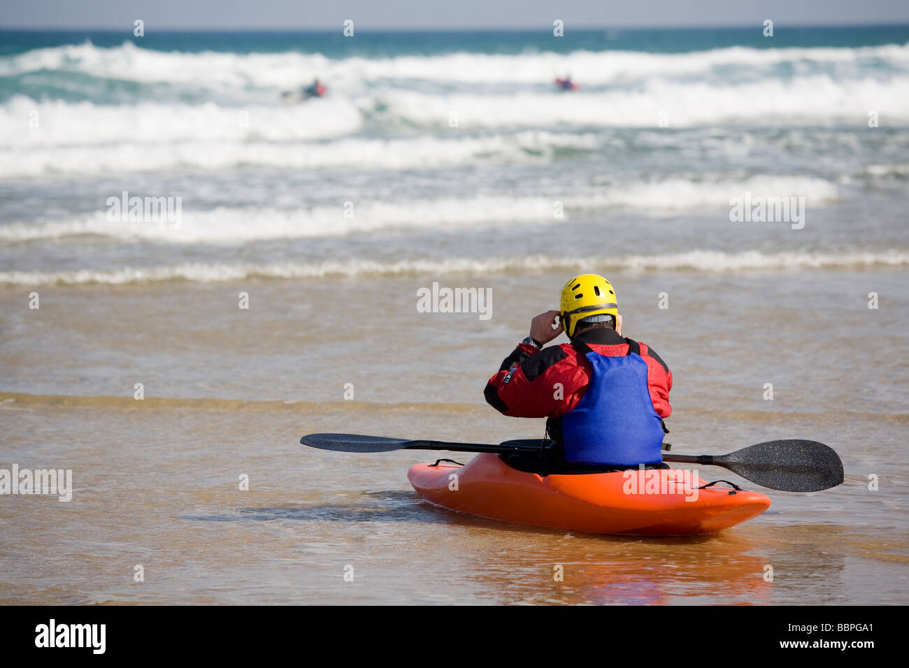 Man canoeing in a beach Stock Photo - Alamy