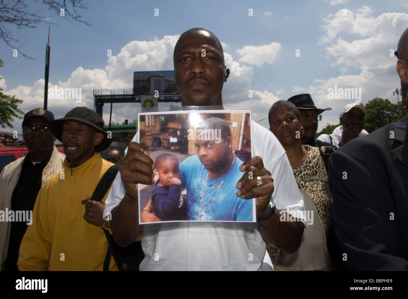 An activist displays a photograph of slain police officer Omar Edwards