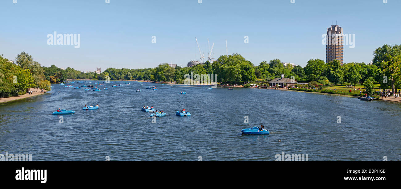 Summers day in Hyde ark London on the Sepentine lake, peddelos in use Stock Photo