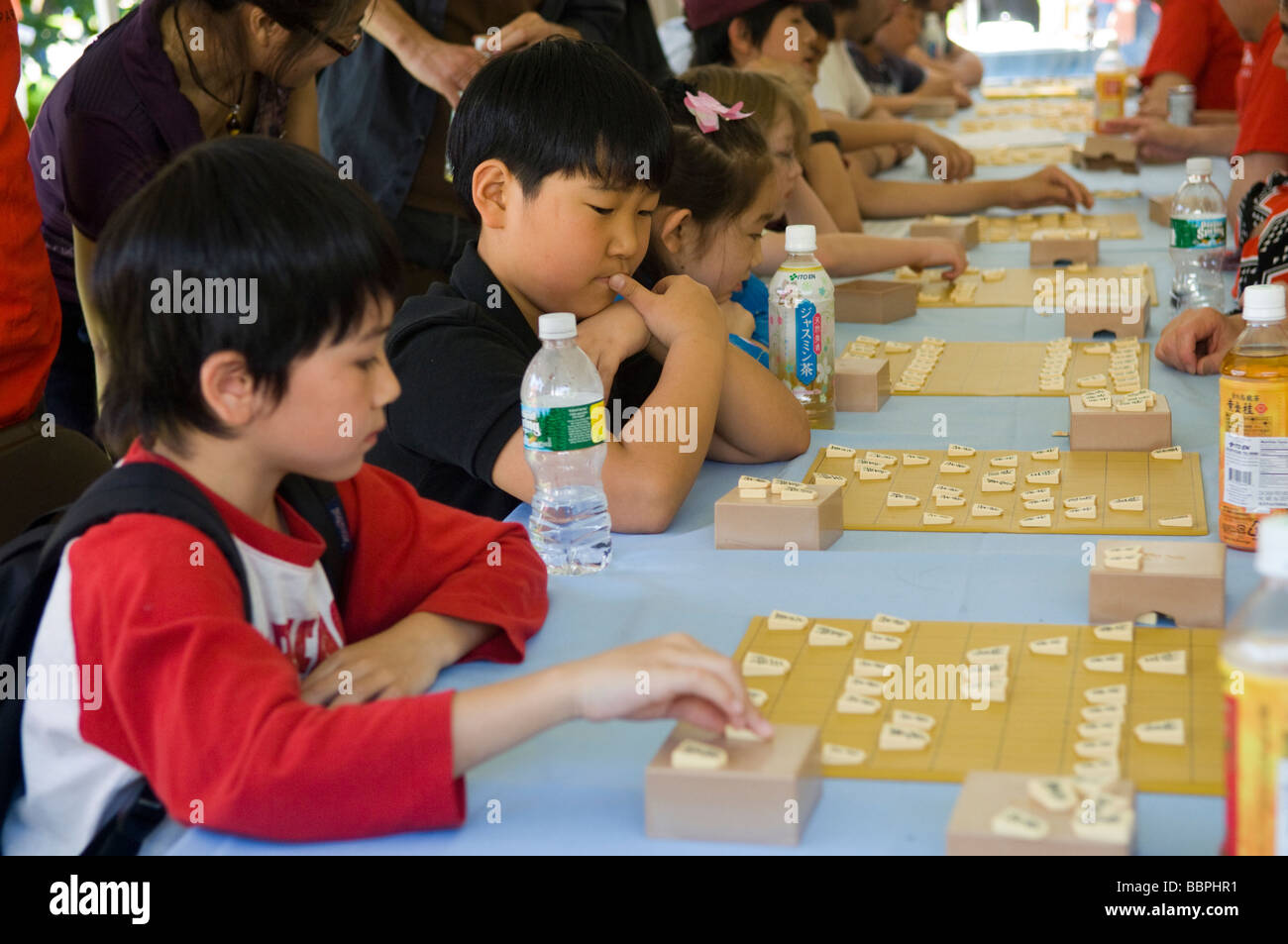 Children play the Japanese game of chess called Shogi Stock Photo