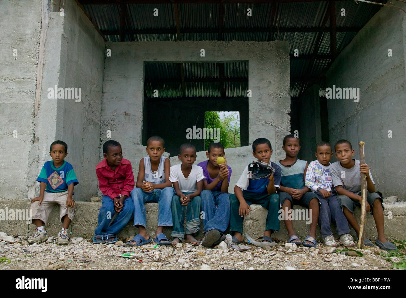 Neiba,Baoruco Province,Dominican Republic,West Indies,Caribbean;Group of young boys posing for the camera after a baseball game Stock Photo