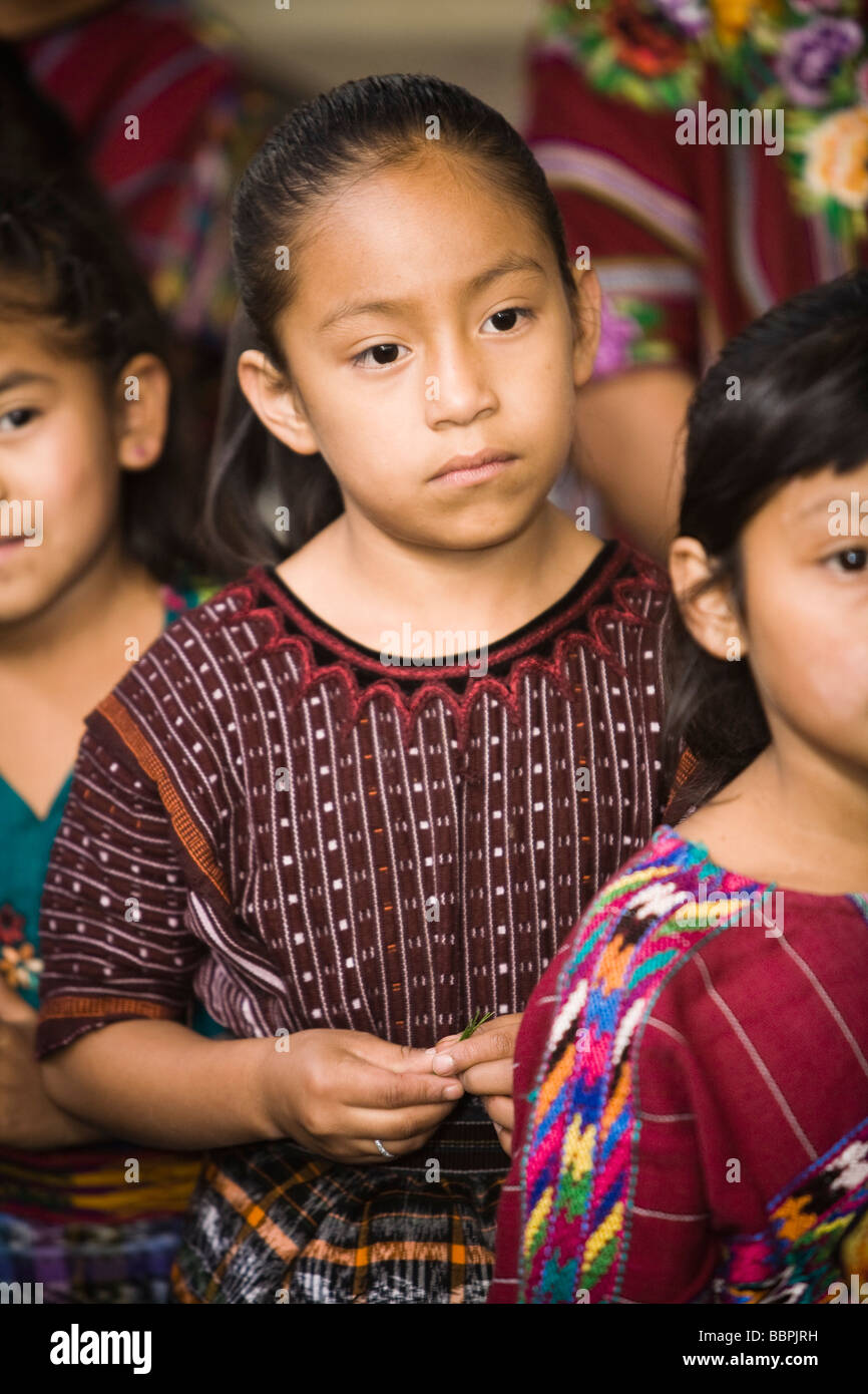 Guatemala;Young girls in traditional clothing waiting in line Stock