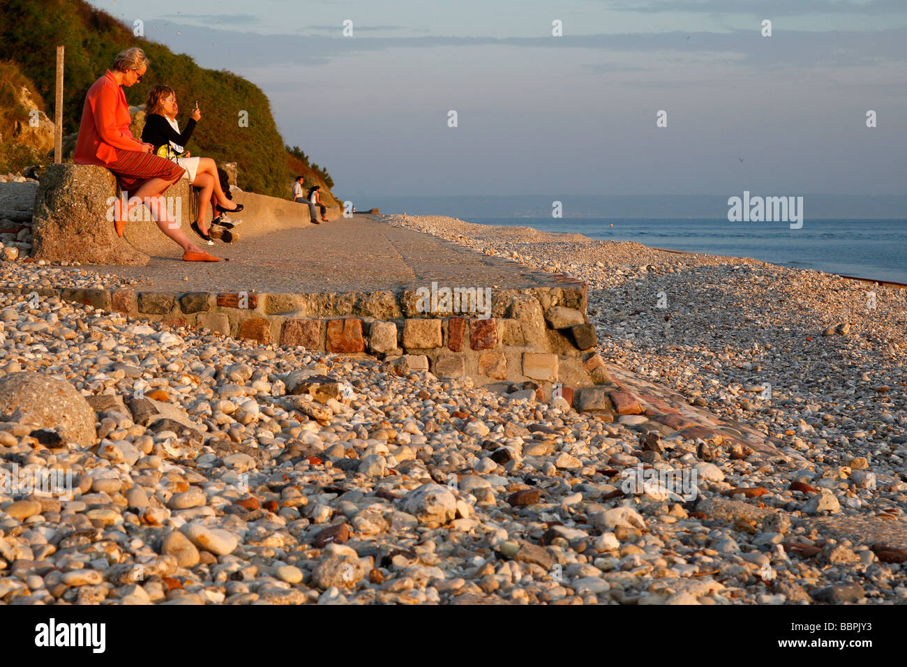 SEA FRONT IN SAINTE ADRESSE AT SUNSET OVER THE SHINGLE BEACH, LE HAVRE, SEINE-MARITIME (76), NORMANDY, FRANCE Stock Photo