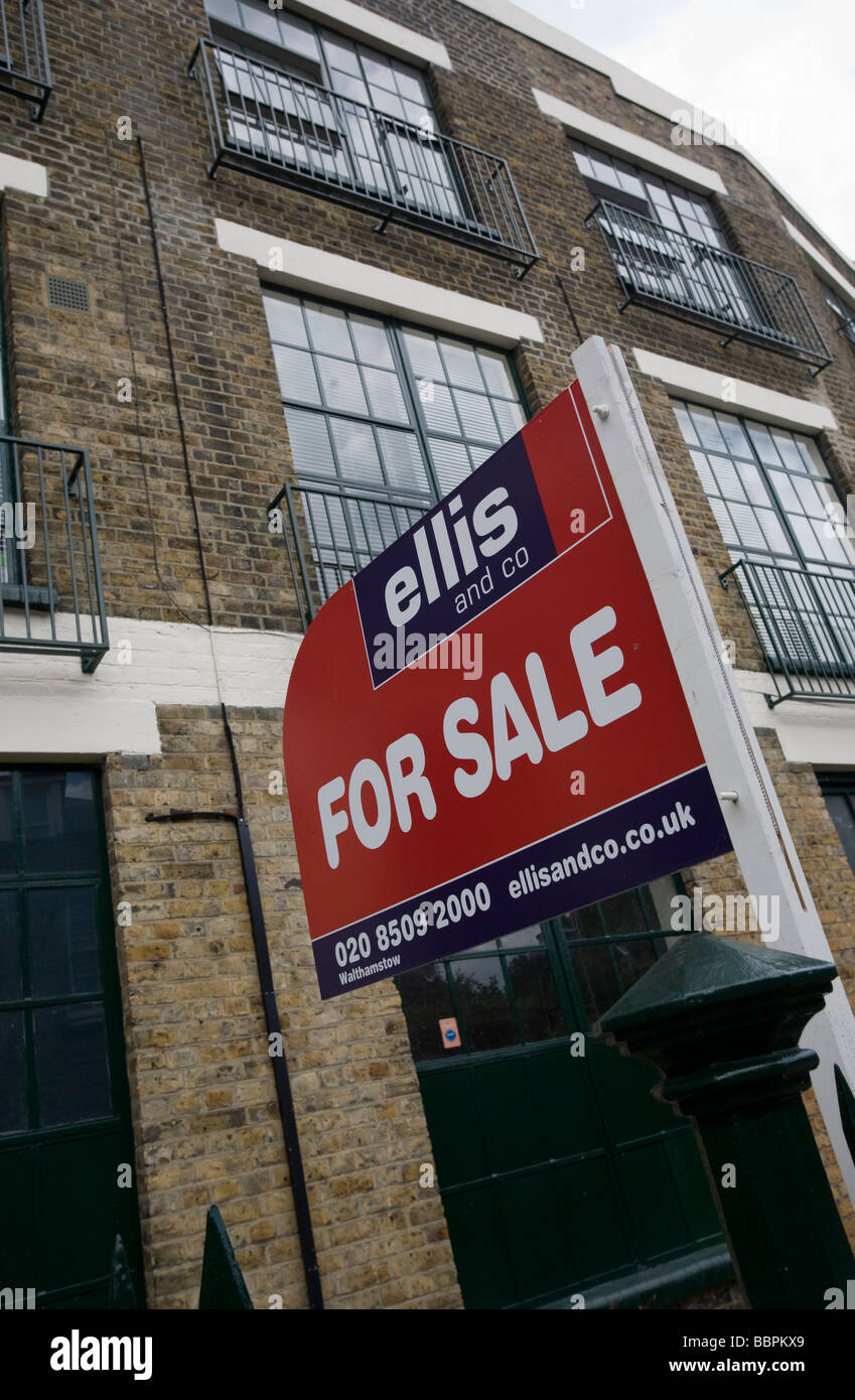 Estate agents "for sale" board outside converted building Walthamstow