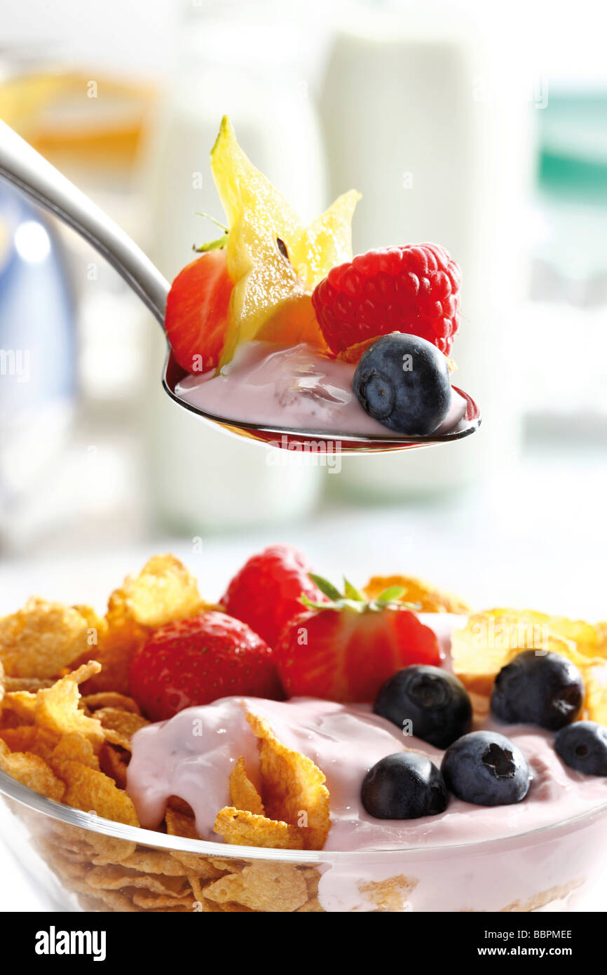 Spoon with yogurt and fruit Stock Photo Alamy