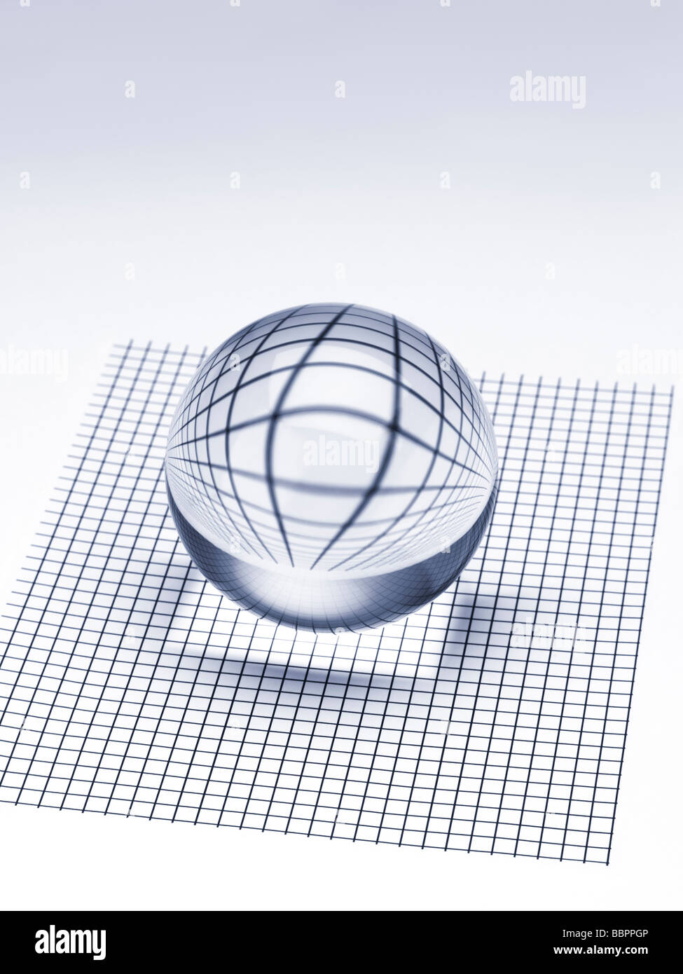 Abstract crystal ball on checked surface Stock Photo