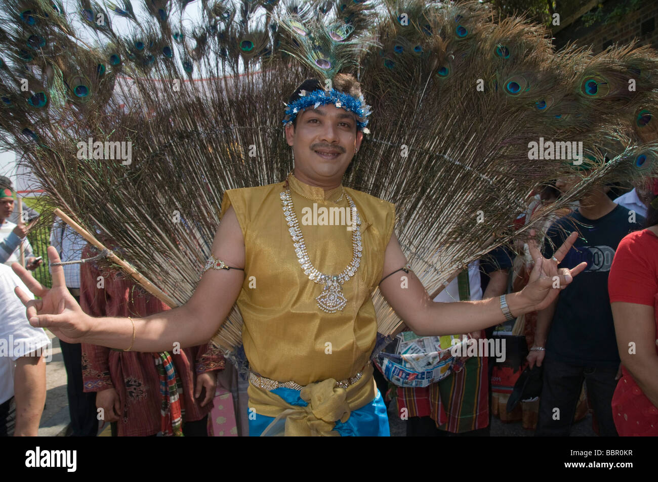 Man with peacock feather costume inBaishakhi Mela Procession celebrating  the Bangladesh New Year in London's Brick Lane Stock Photo - Alamy