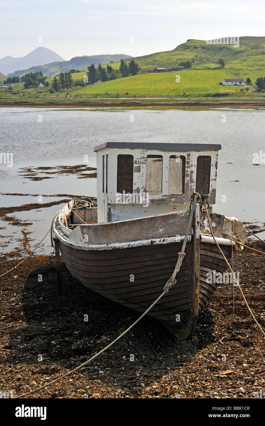 Beached, derelict, wooden fishing boat. Merkadale, Loch Harport, Minginish, Isle of Skye, Inner Hebrides, Scotland, U.K., Europe Stock Photo
