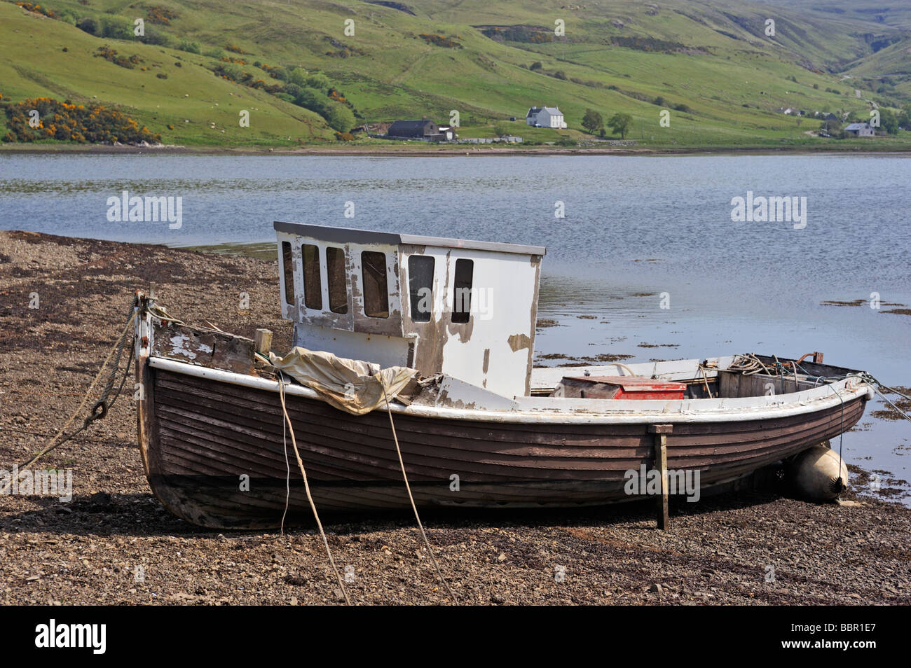 Beached, derelict, wooden fishing boat. Merkadale, Loch Harport, Minginish, Isle of Skye, Inner Hebrides, Scotland, U.K., Europe Stock Photo