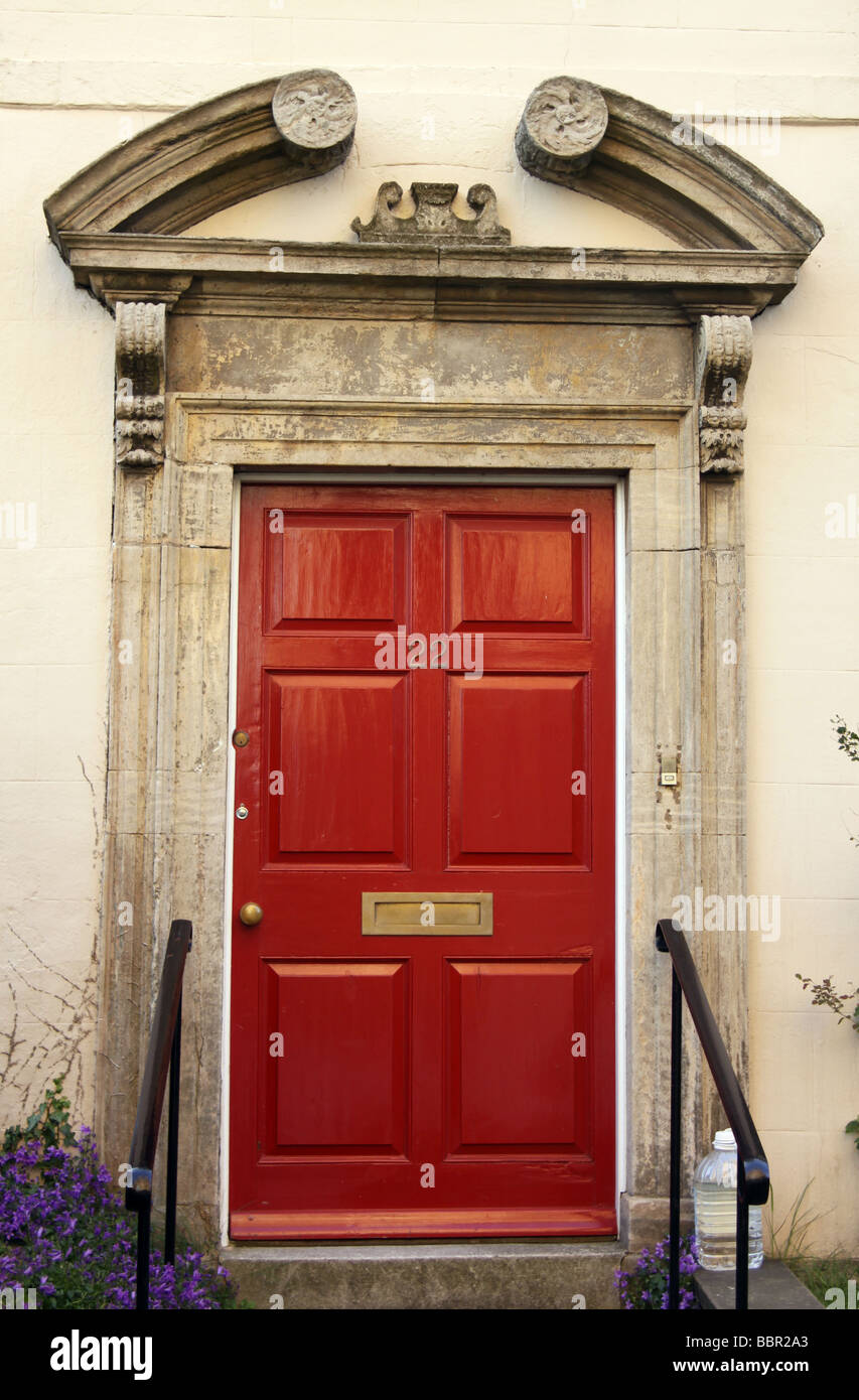 Red front door with the number 22 Stock Photo