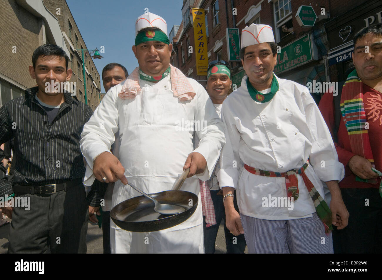 Chefs with frying pan in Baishakhi Mela Procession celebrating the