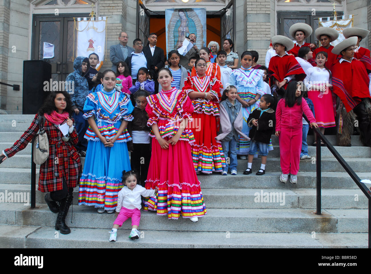South and Central American Immigrants prepare to perform their traditional dances during a church festival in New Haven CT USA Stock Photo