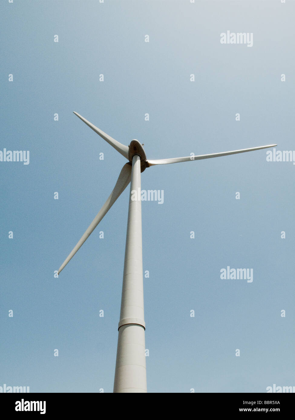Wind turbine against the blue sky Stock Photo - Alamy