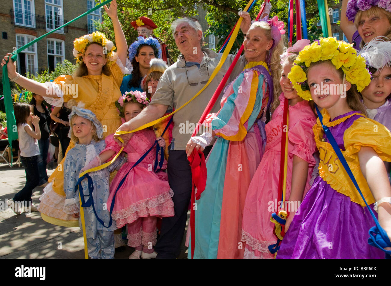 Maypole Kids Donna Maria and her Maypole children pose with a guest at the Covent ...