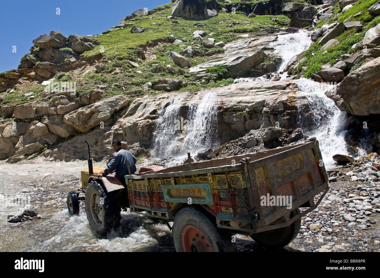 Tractor on the Manali-Leh road. Near Rohtang La Pass .Himachal Pradesh. India Stock Photo
