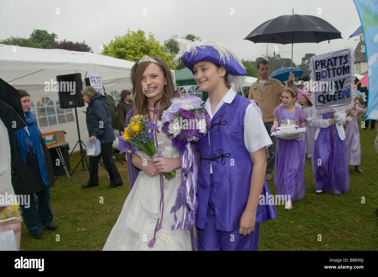 Pratts Bottom May Queen and Prince hold flower bouquets at the Village