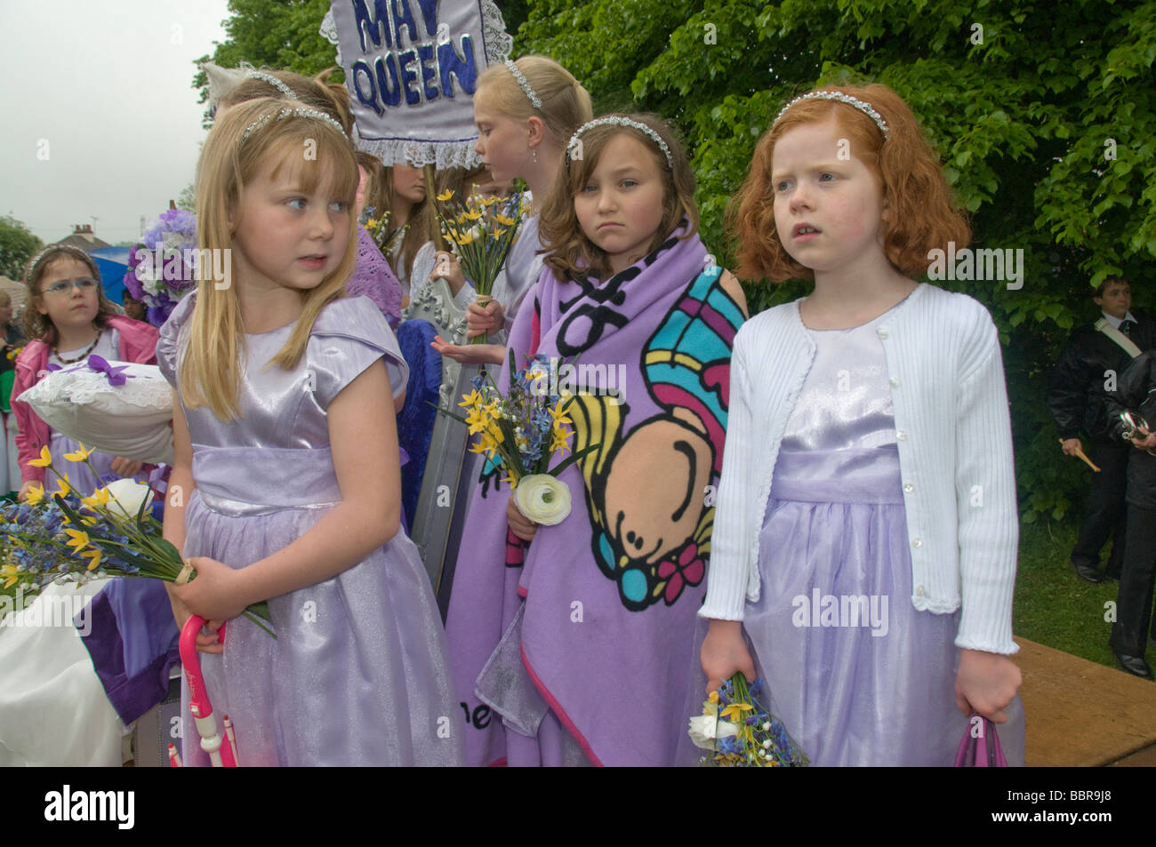 Young girls from the Pratts Bottom May Queen group in lilac dresses with  flowers at the Village Fete Stock Photo - Alamy