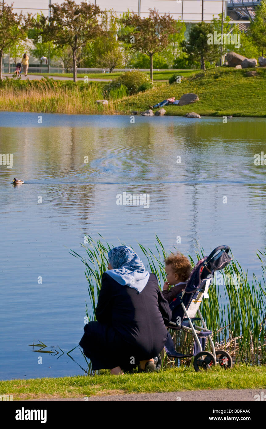 Muslim lady at a park in Montreal Stock Photo