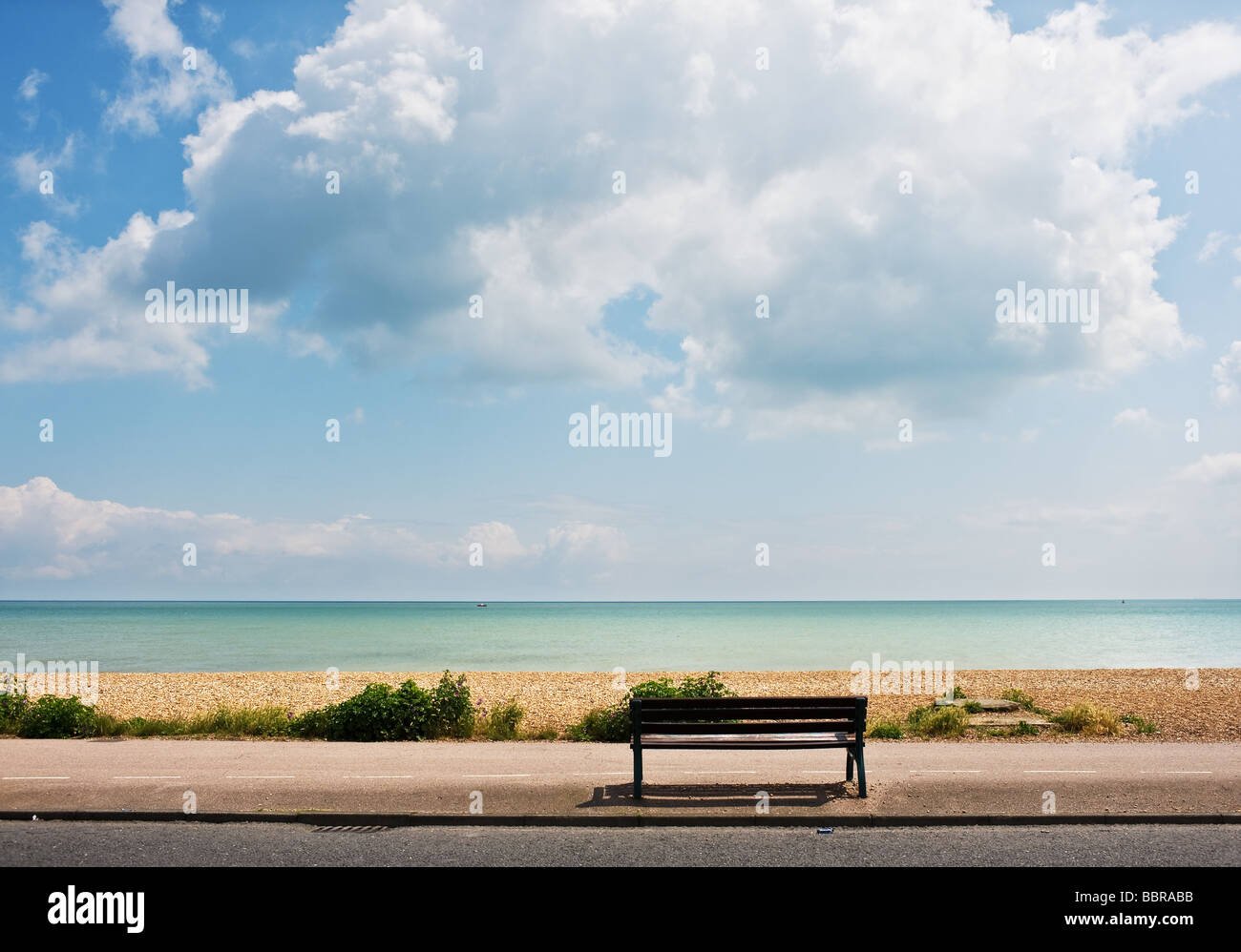 An empty bench on the promenade at deal in Kent. Stock Photo