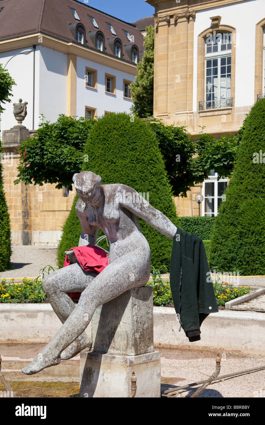 Statue in the formal garden of the Hotel du Peyrou being used as a coat rack Neuchatel Switzerland. Charles Lupica Stock Photo
