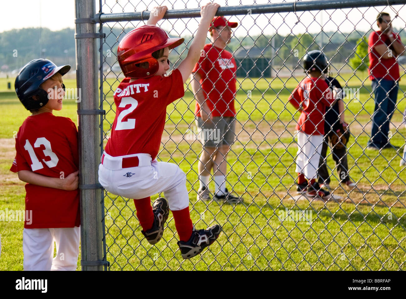 boys playing a baseball game Stock Photo Alamy