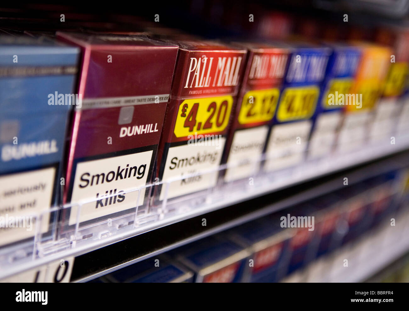 Packets of cigarettes made by British American Tobacco sit on the shelf of a retail store Stock Photo