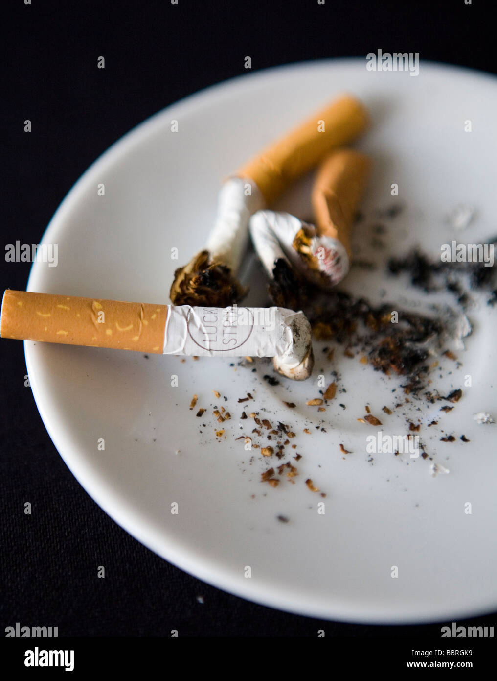 Cigarettes made by British American Tobacco in an ashtray Stock Photo