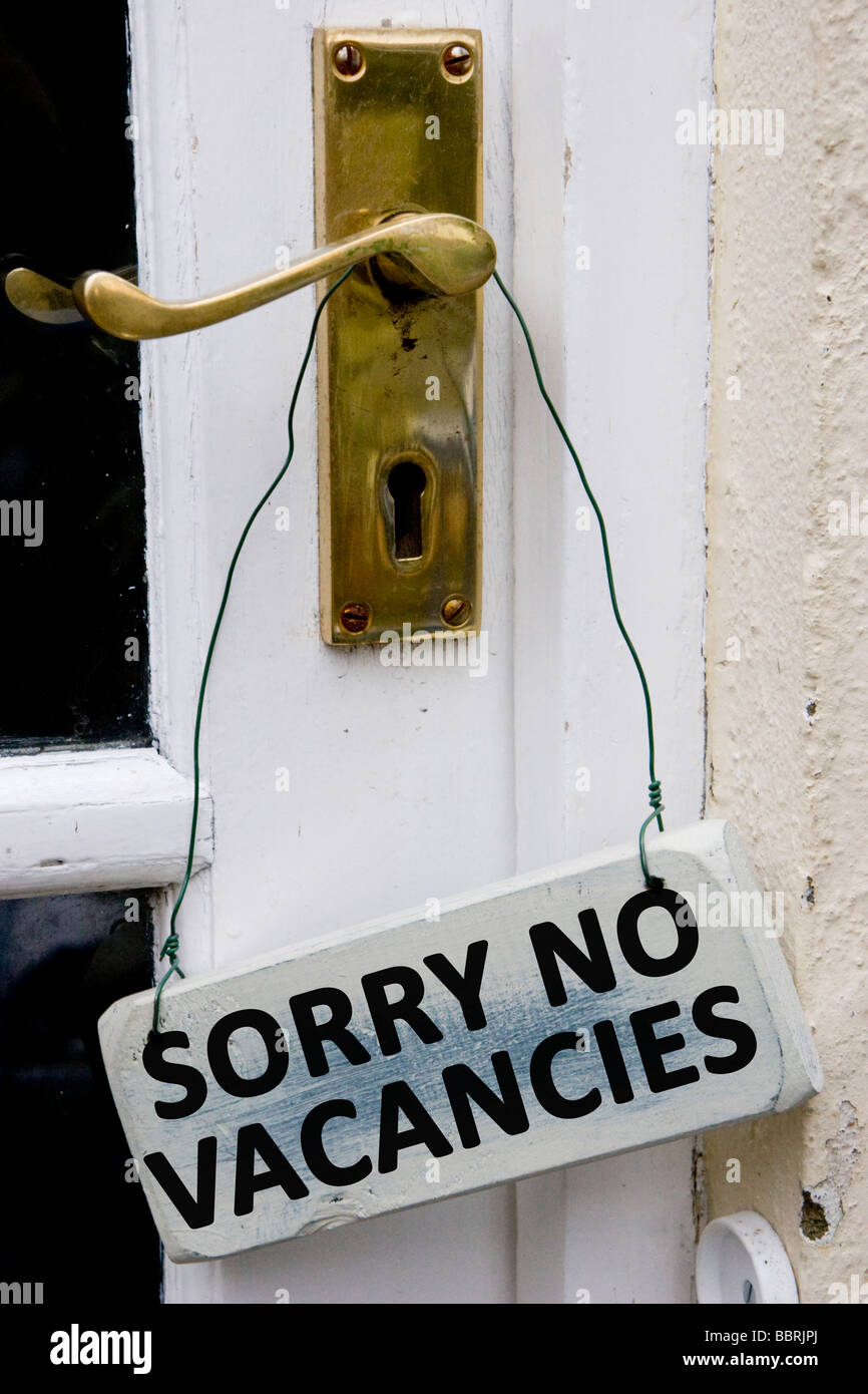 Door sign with the message Sorry No Vacancies Stock Photo