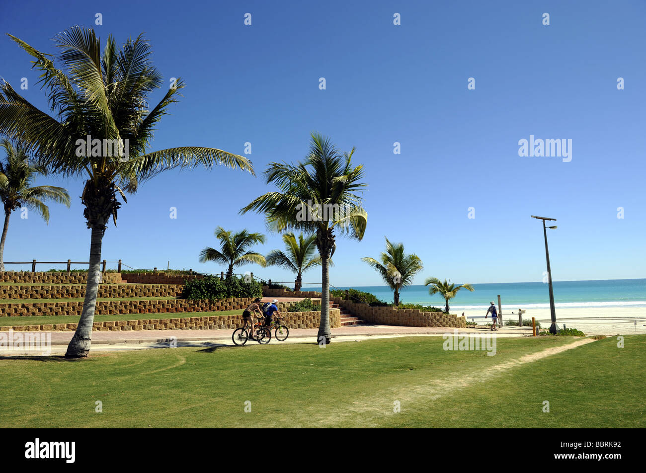 Cyclists ride to Cable Beach in Broome , Western Australia. Stock Photo