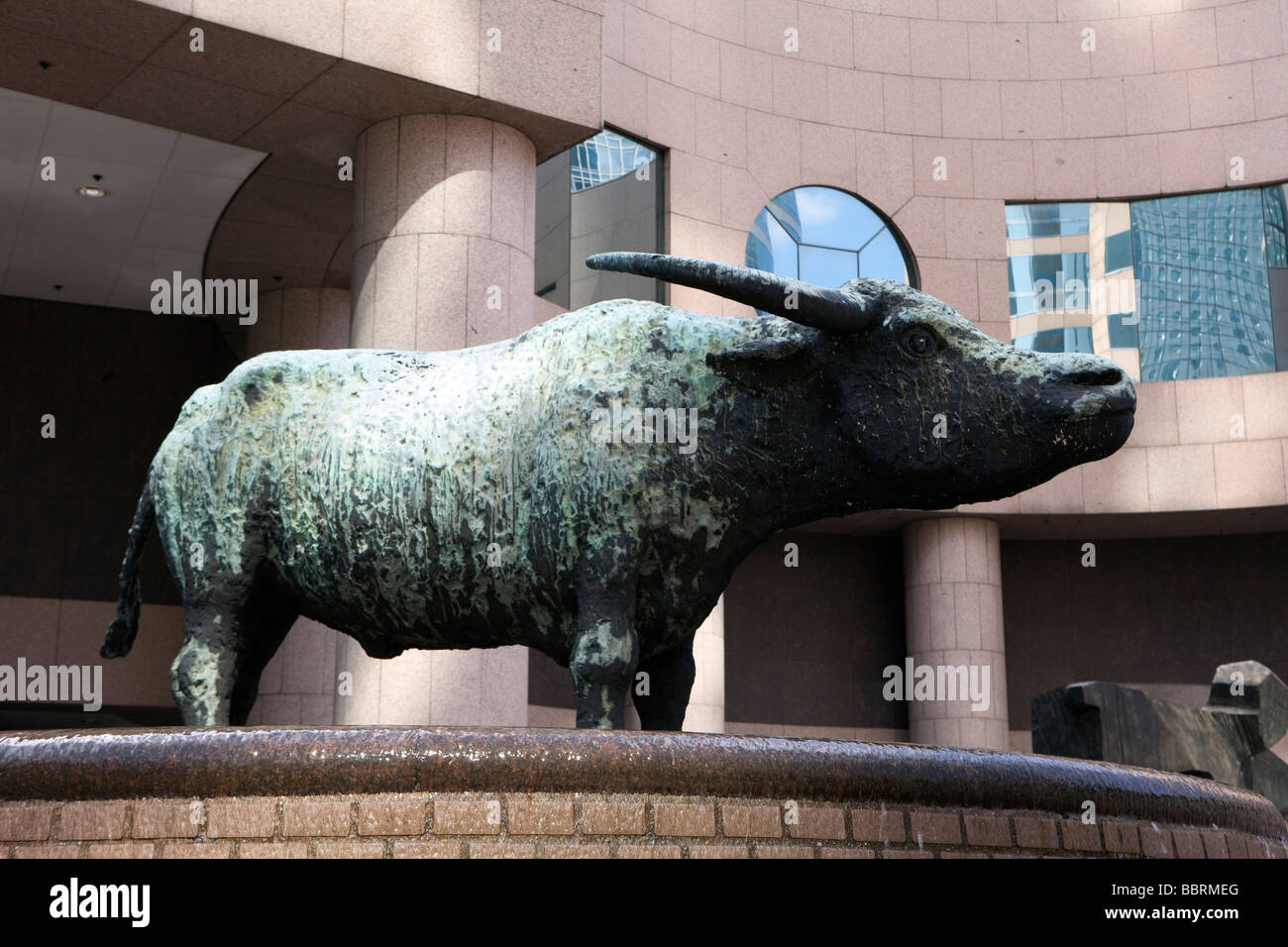 A bull statue is seen in a courtyard at the International Finance