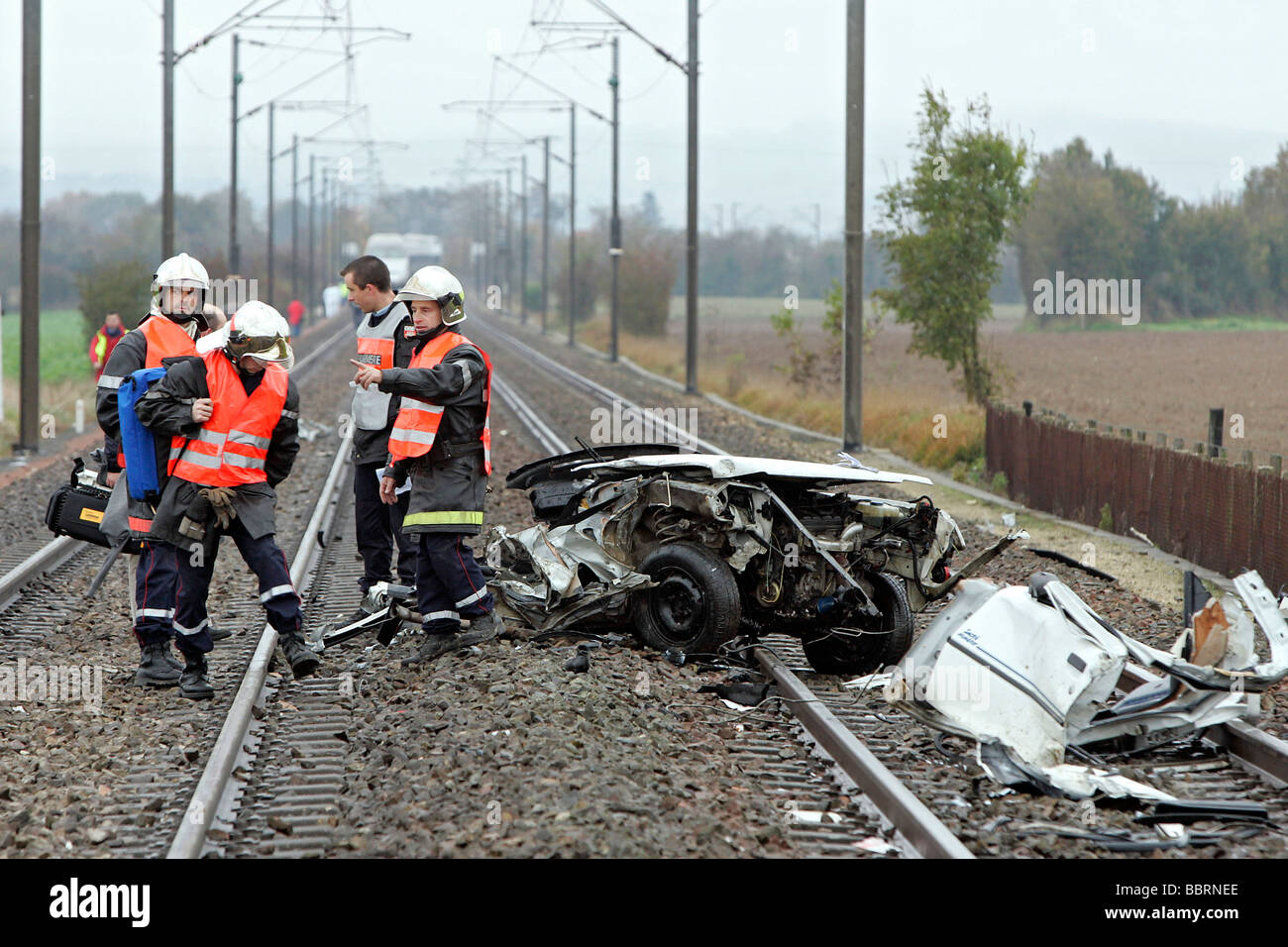 FIREFIGHTERS AT THE SCENE OF A TRAIN ACCIDENT, TGV CRASHED INTO A CAR, ONE PERSON KILLED, TOWN OF CRISSE, SARTHE (72), FRANCE Stock Photo
