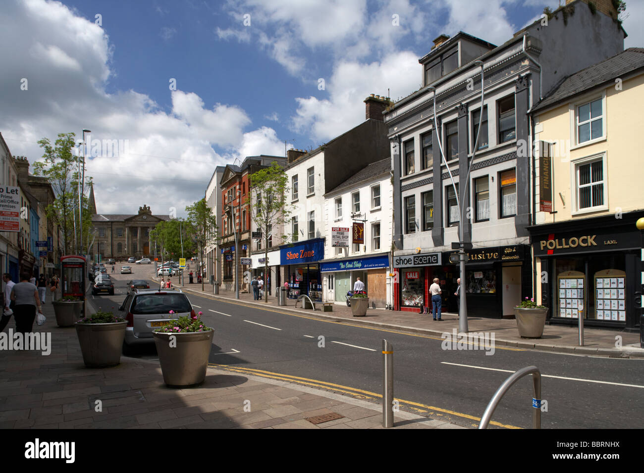 shops in the main high street of omagh town centre leading up to the
