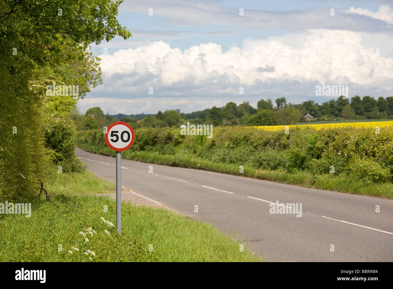 50 MPH speed limit sign on rural road Stock Photo