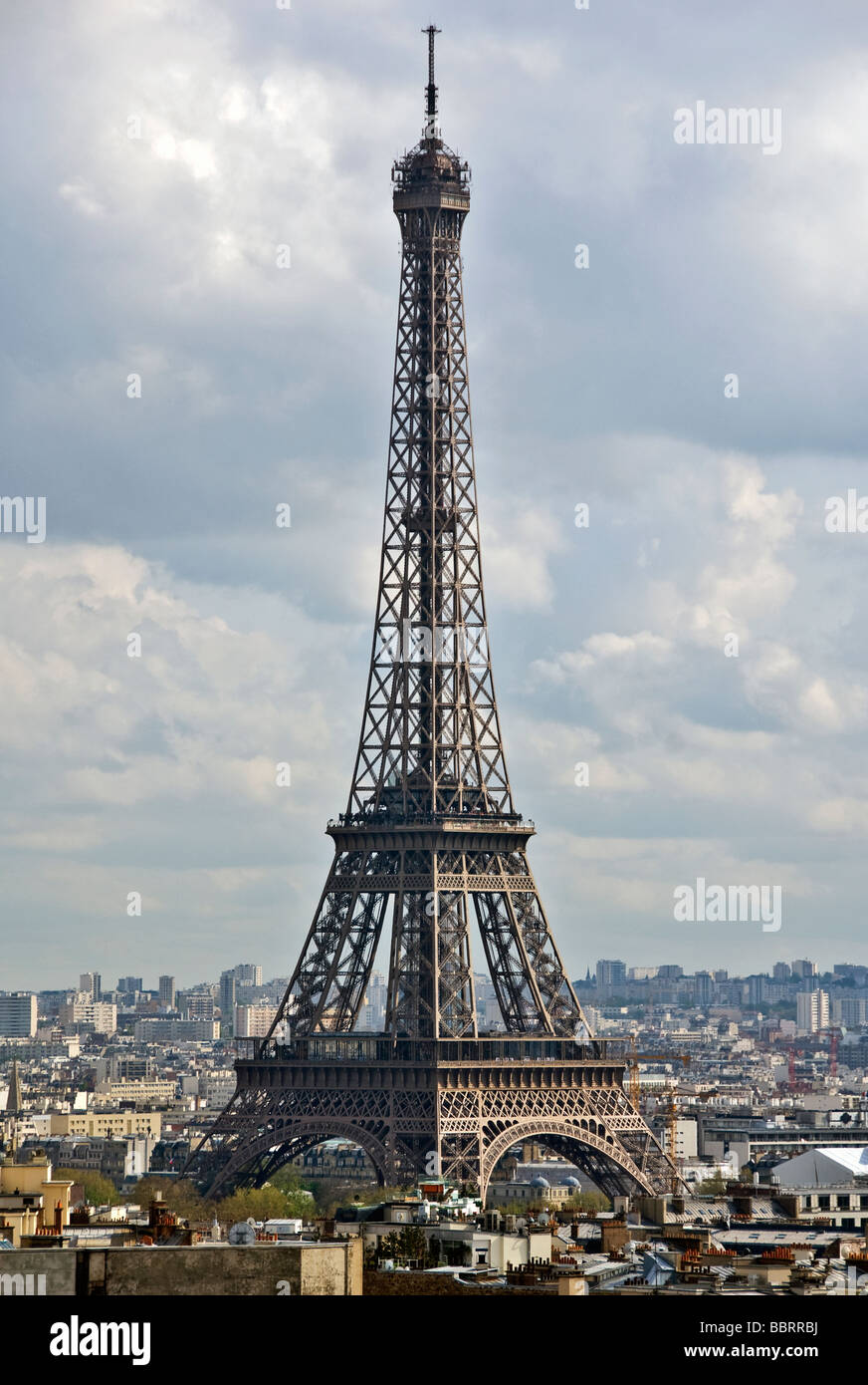 Paris Champ-de-Mars Eiffel Tower Grande Dame whole building cloudy overcast sky cityscape Stock Photo