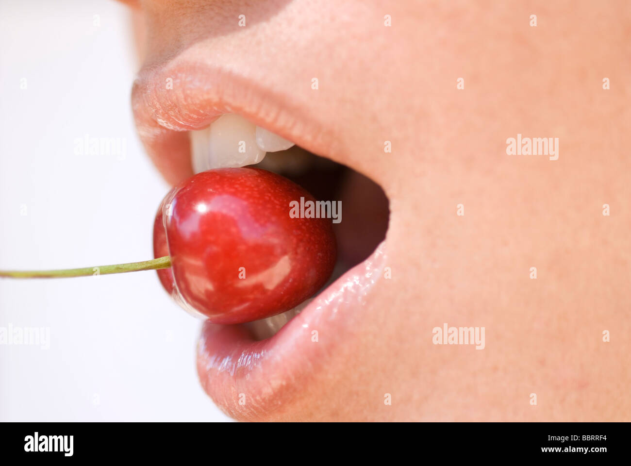 woman with cherry Stock Photo Alamy