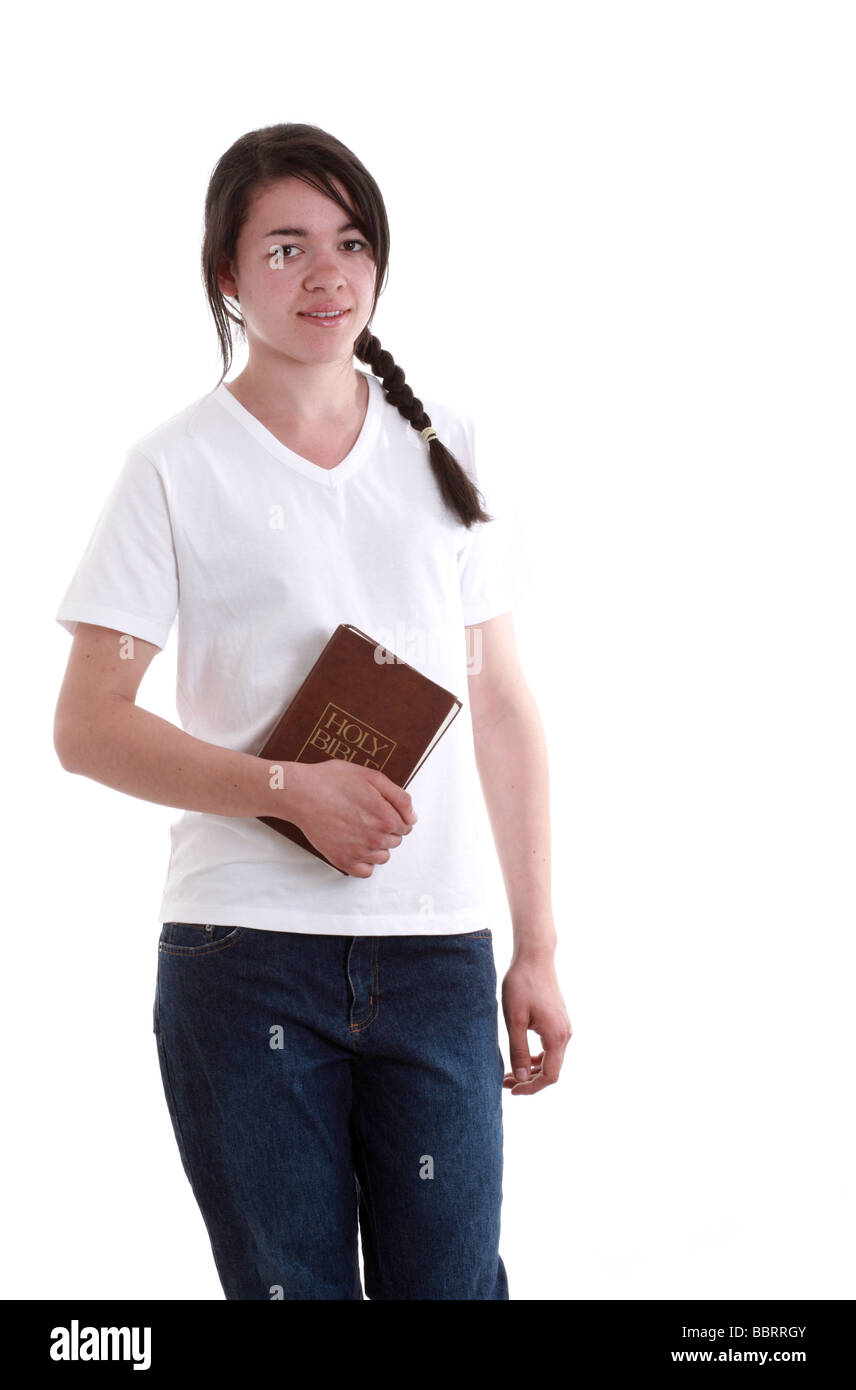 Mixed race schoolgirl in with her bible Stock Photo