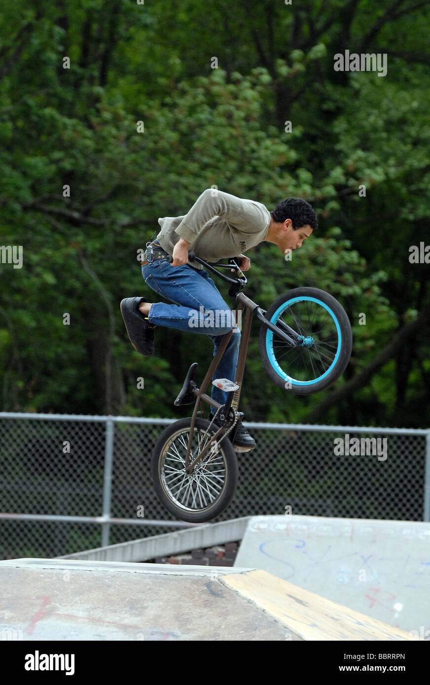 A youth jumps on a BMX bike in New Haven CT USA Stock Photo - Alamy
