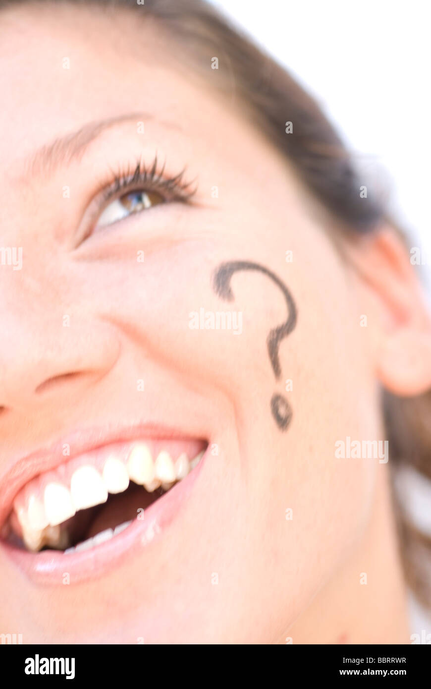 Question mark simbol painted in woman´s face and thinking on answer Stock Photo