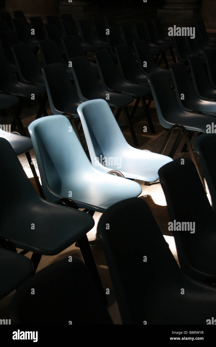 rows of empty plastic chairs in church in rome italy Stock Photo Alamy