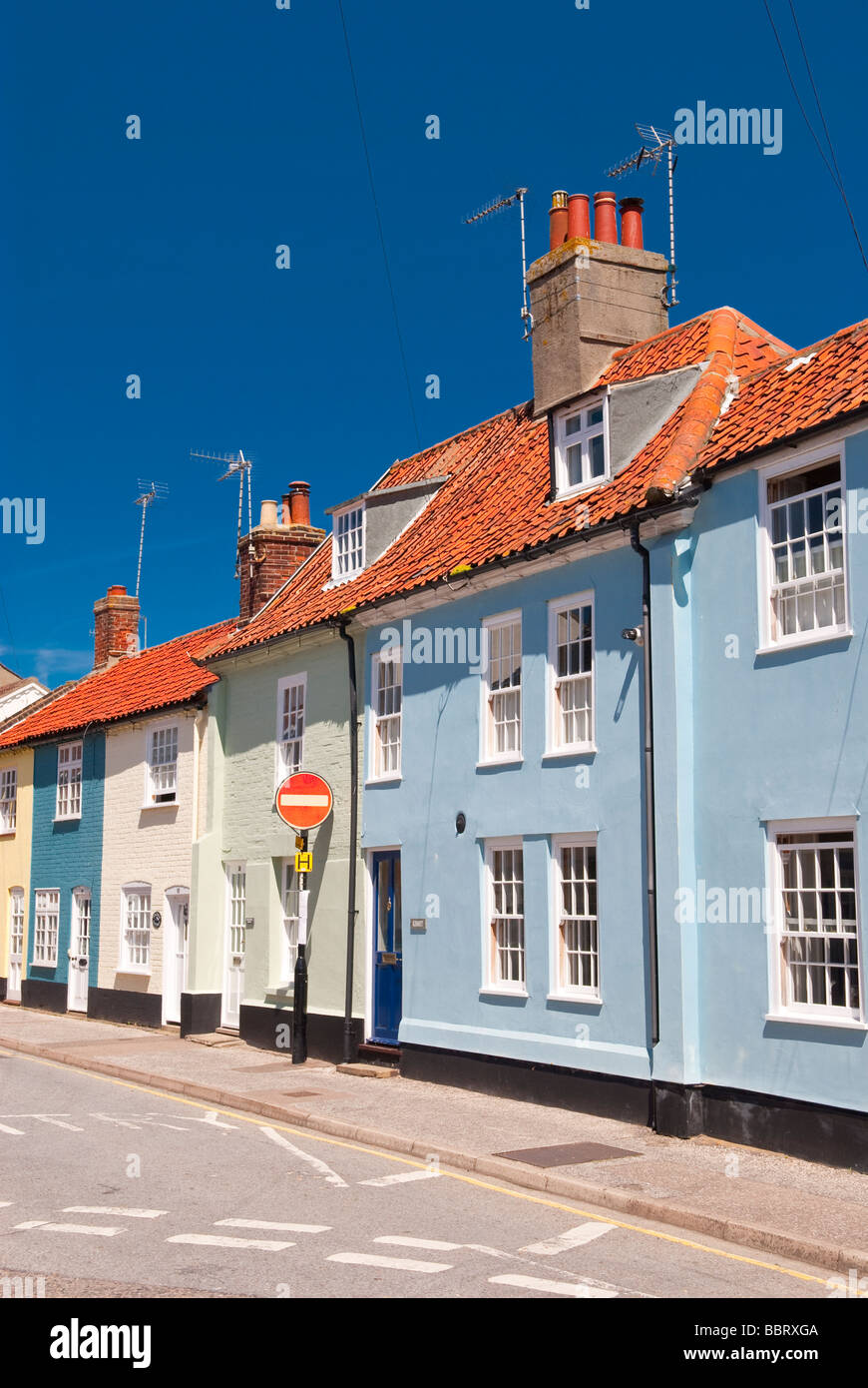 A view of a row of pretty terraced colourful houses in the seaside town of Southwold Suffolk Uk Stock Photo