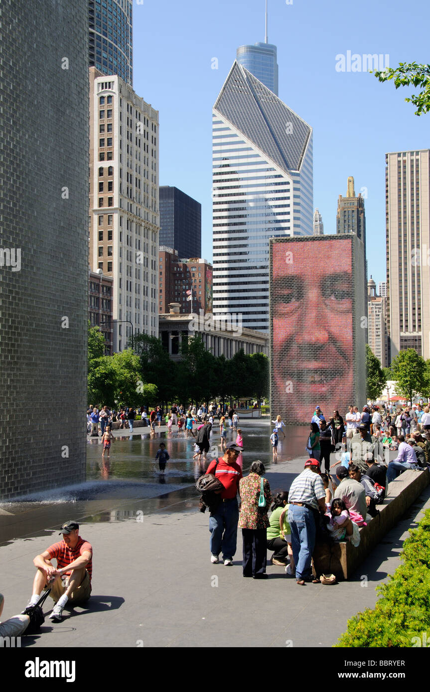 The Crown Fountain in Millennium Park downtown Chicago visitors enjoying a sunny day in the city Stock Photo